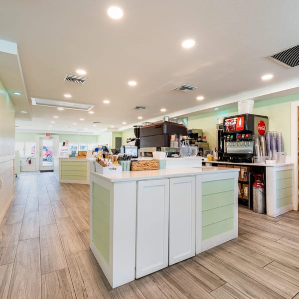 Interior of Beachcomber Trading Post Restaurant with a Coca-Cola soda fountain and coffee machine.